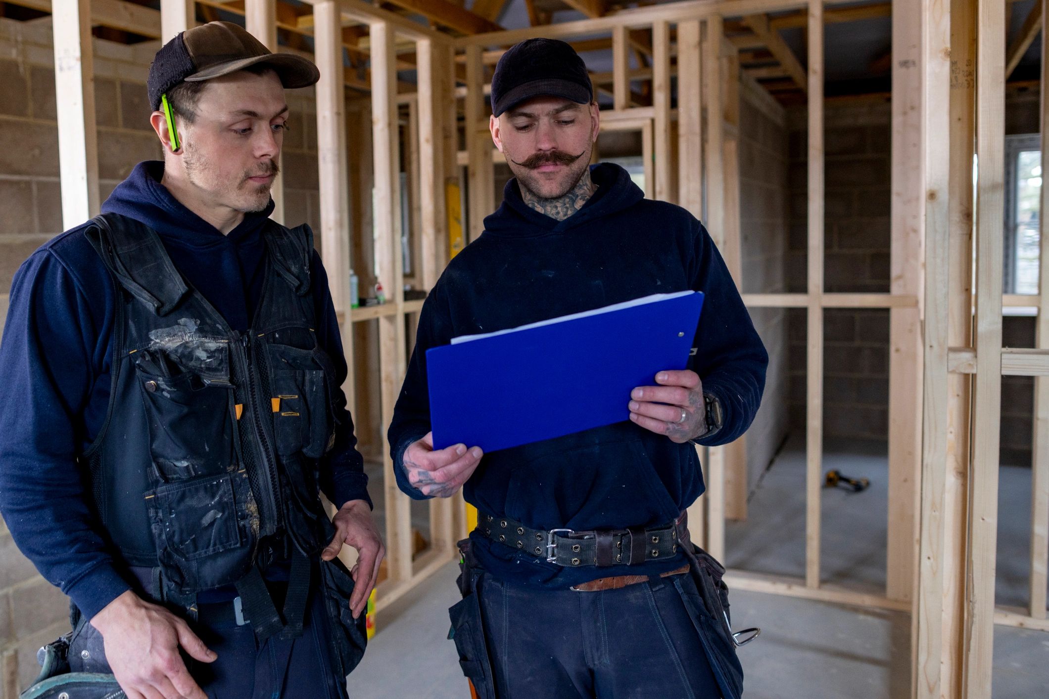 Builders looking over construction plans