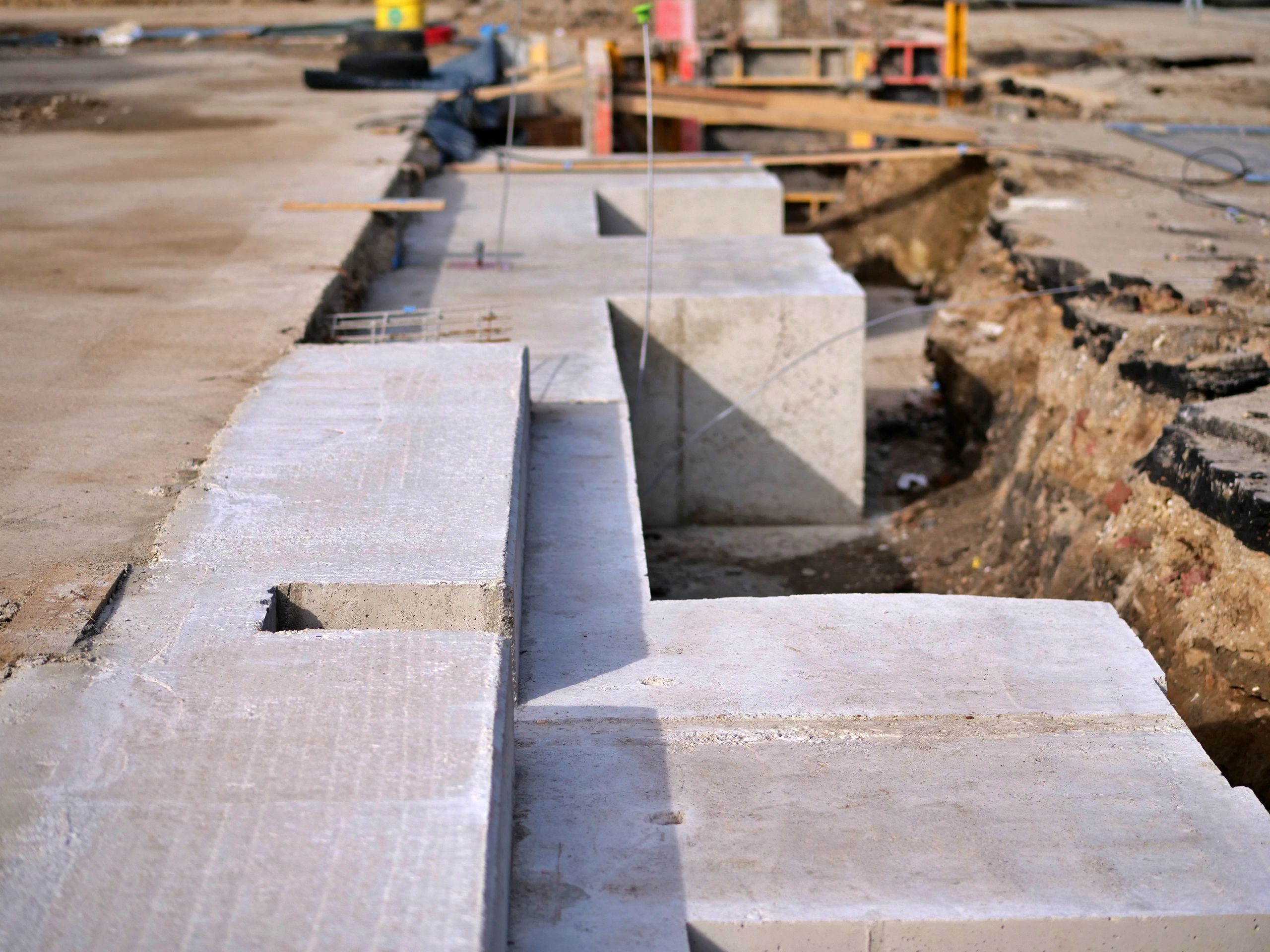 Construction foundation and wall work representing block wall permit projects